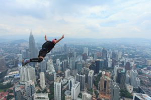 Kuala Lumpur, Malaysia-September 30, 2011: A BASE jumpers in jumps off from Kuala Lumpur Tower. KL Tower BASE Jump is an annually event and participants from experienced BASE jumpers from all around the world.